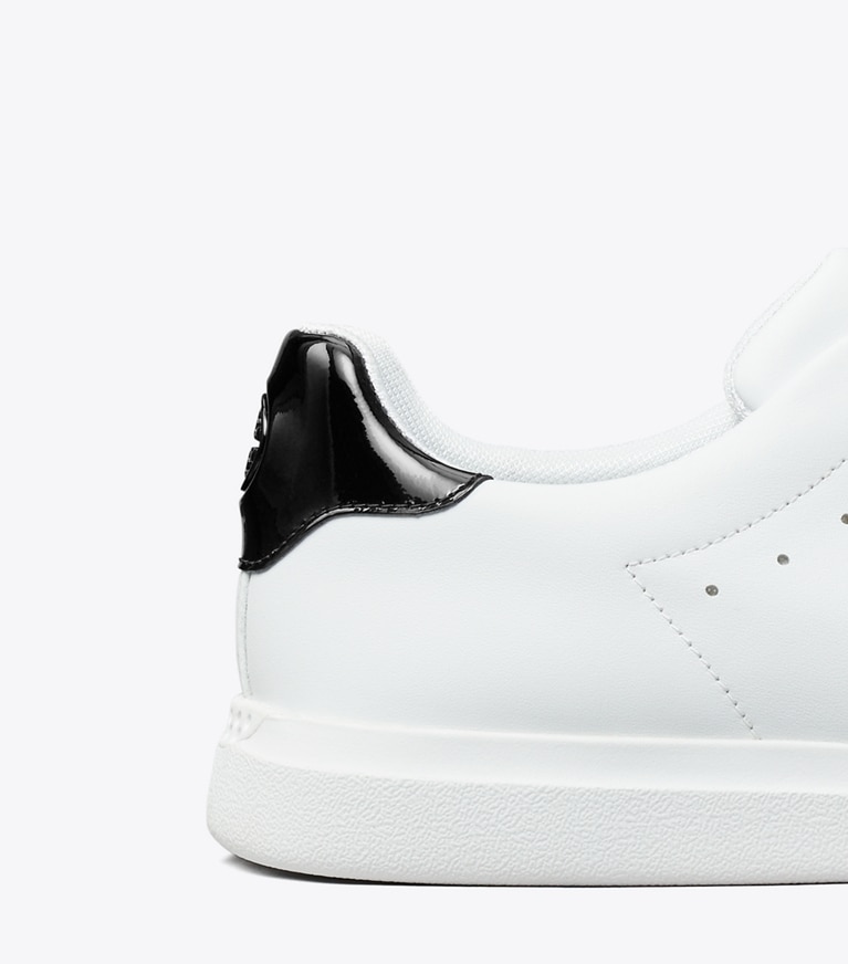 Tory Burch designer sneakers Howell Court Sneaker in Titanium White / PERFECT BLACK angle