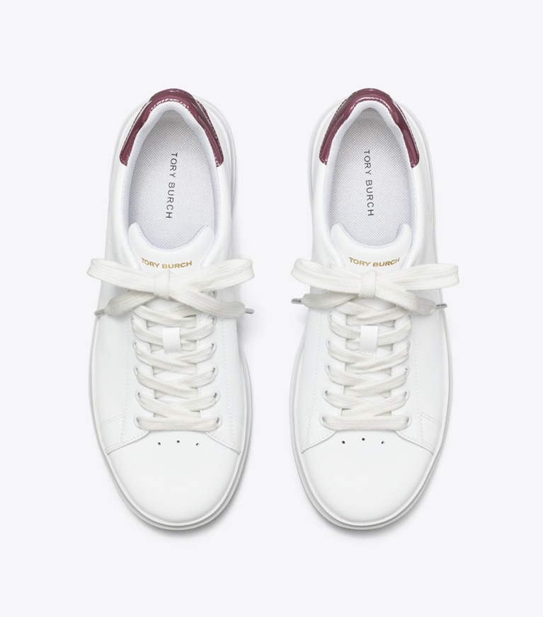 Tory Burch designer sneakers Howell Court Sneaker in Titanium White / Vintage Eggplant angle