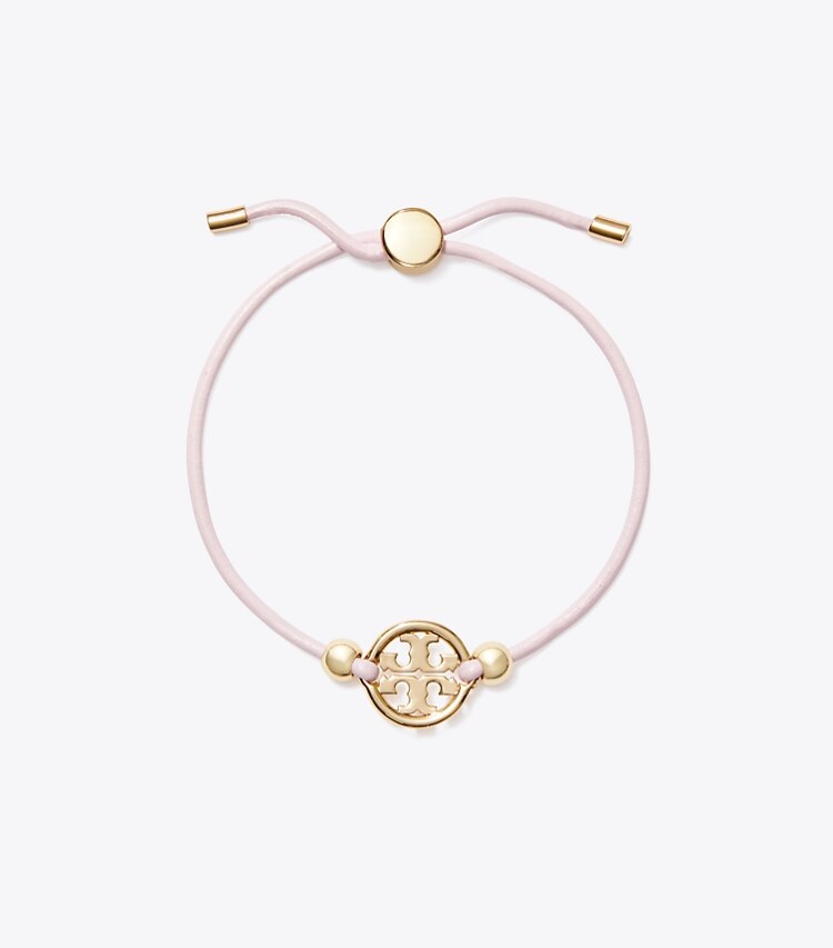 Tory Burch designer armbänder Icon Armband mit Schiebeverschluss in Tory Gold / Pink front
