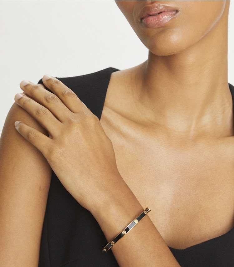 Tory Burch designer bracelets Icon Enamel Hinge Bracelet in Tory Gold / Black accessory on model