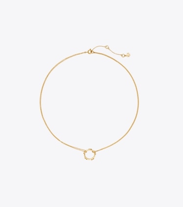 Tory Burch designer halsketten Icon Halskette mit nietenbesetztem Ringanhänger in Tory Gold front