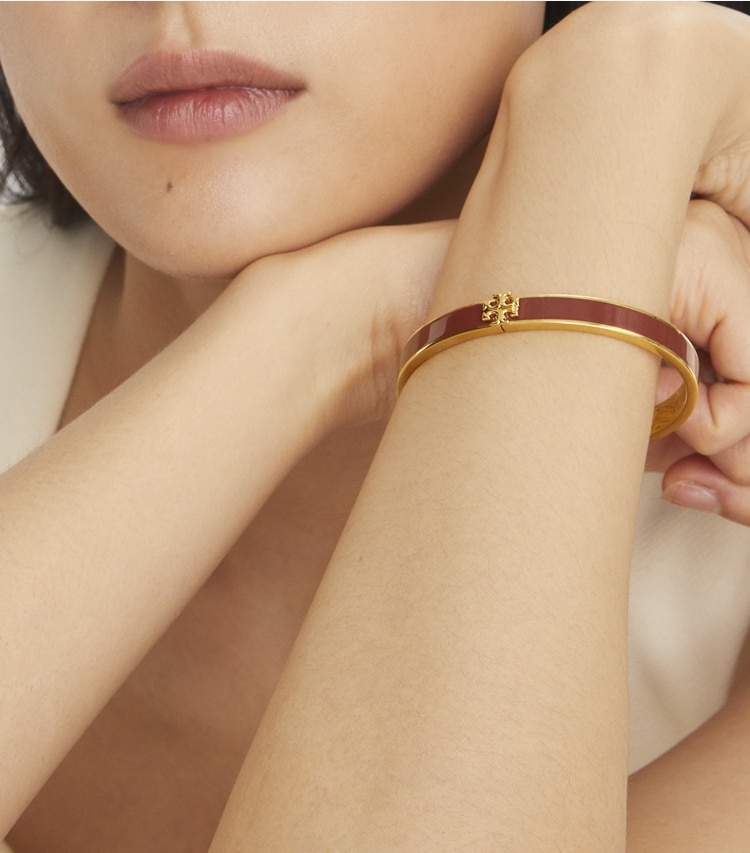 Tory Burch designer bracelets Icon Medium Enamel Bracelet in Tory Gold / New Ivory accessory on model