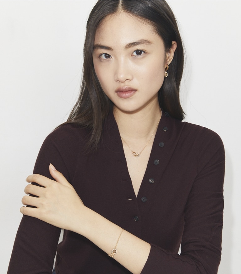 Tory Burch designer necklaces Icon Pavé Interlocking Pendant Necklace in Tory Gold / Crystal front