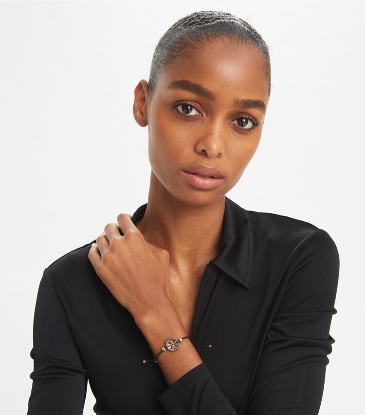 Tory Burch designer bracelets Icon Slider Bracelet in Tory Gold / Sparkle Pink / Crystal accessory on model