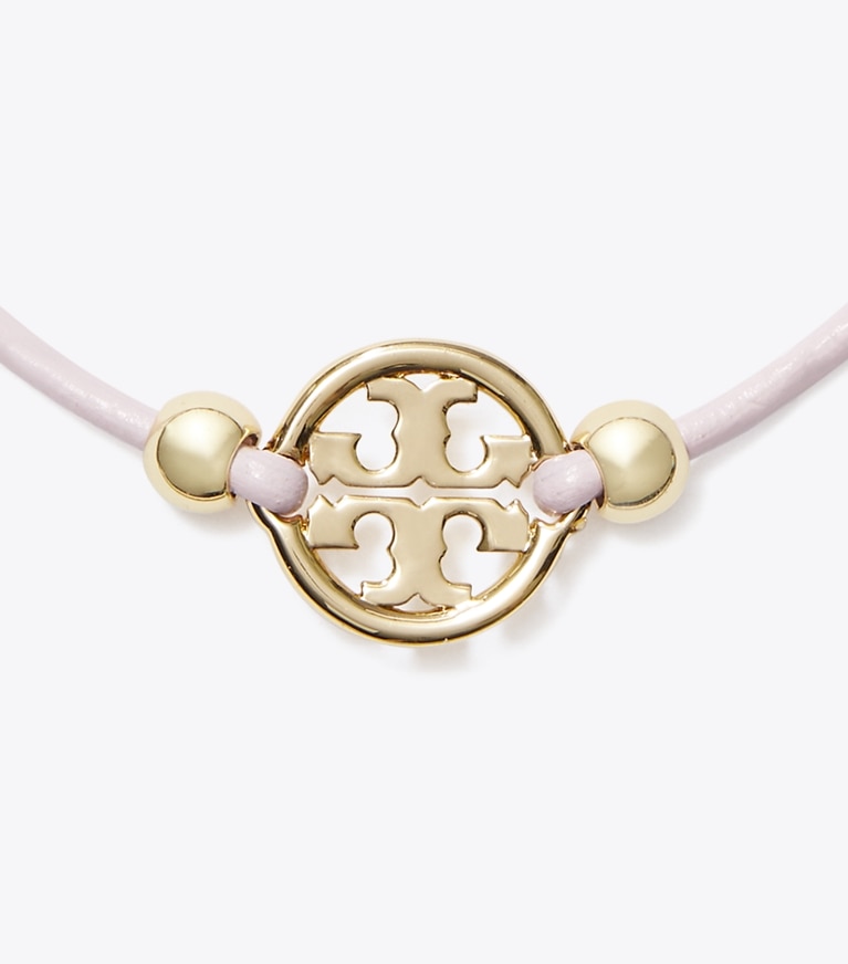 Tory Burch designer ブレスレット ミラー スライダー ブレスレット in Tory Gold / Pink front