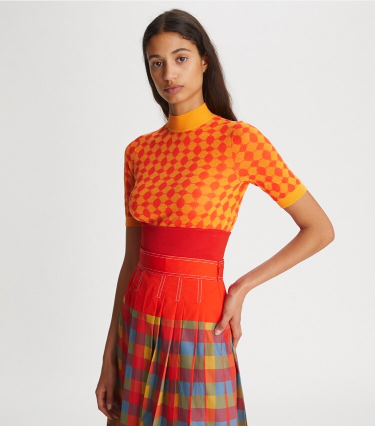 Tory Burch designer sweaters Jacquard Knit Mock-Neck in Bright Bitter Orange / Poppy Red on model detail