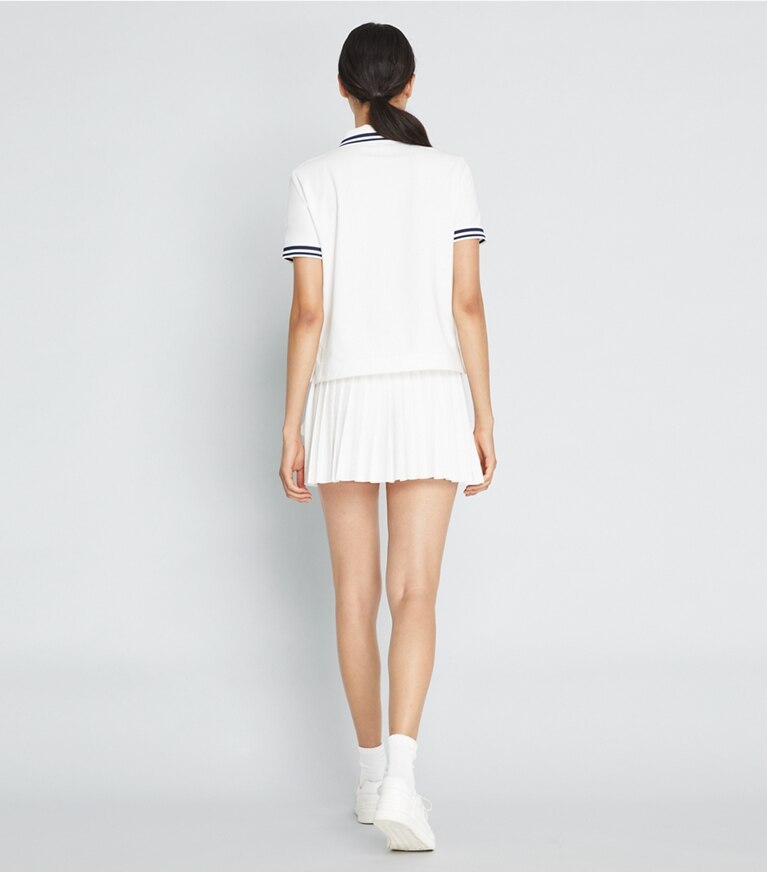 Tory Sport designer bottoms Jacquard Performance Jersey Pleated Overlay Skirt in Snow White front