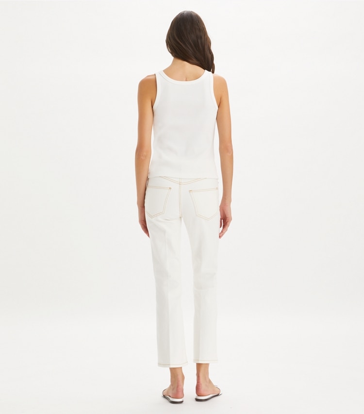 Tory Burch designer bas Jean évasé court in White Chalk Wash on model back