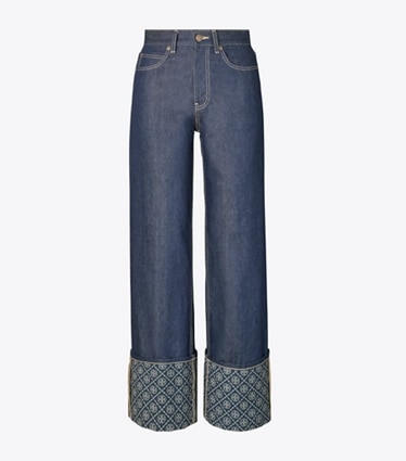 Tory Burch diseñador prendas inferiores Jeans de pierna recta con puño en contraste con monograma T en Raw/Unwashed frente