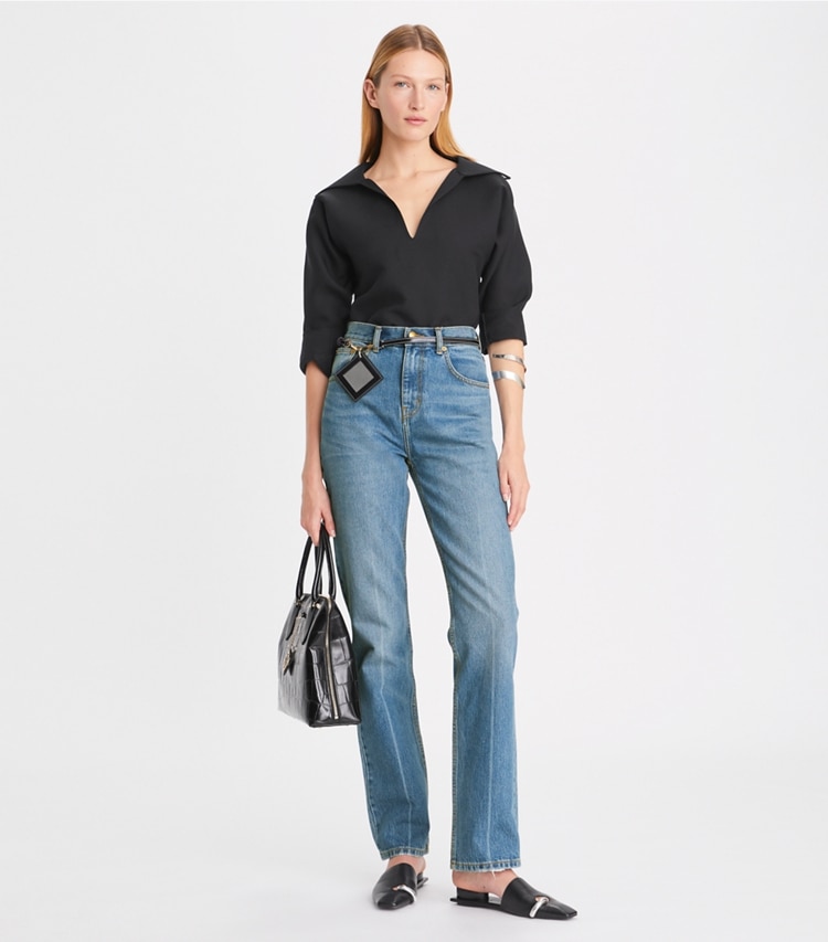 Tory Burch designer pantaloni Jeans slim a vita media con gamba dritta in Light Crease Wash parte anteriore su modella