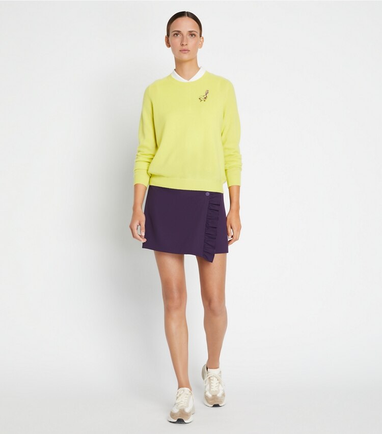 Tory Sport diseñador suéteres Jersey raglán de cachemira con pajarito en Lemon Glow en el modelo (frente)