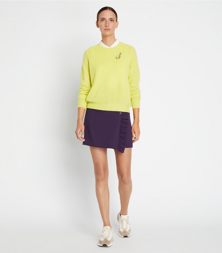 Tory Sport diseñador suéteres Jersey raglán de cachemira con pajarito en Lemon Glow en el modelo (frente)