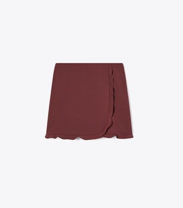 Tory Burch designer bas Jupe de golf extensible à volants dans Dark Sangria de face