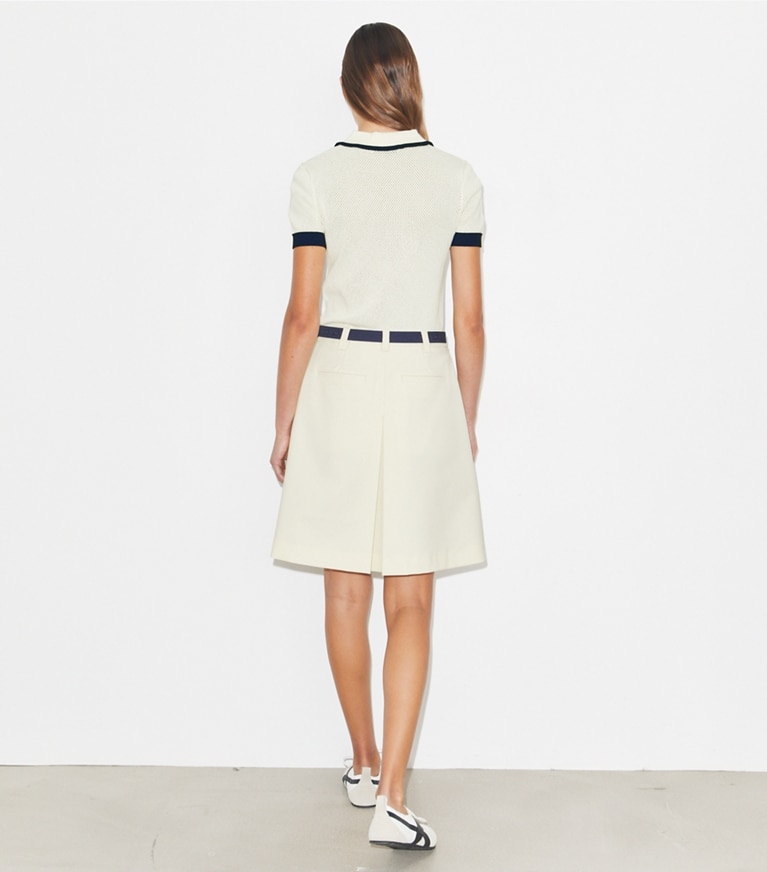 Tory Burch designer bas Jupe de golf plissée extensible in New Ivory on model back