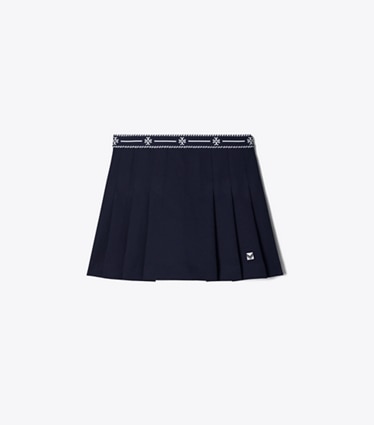 Tory Burch designer bas Jupe de tennis en sergé technique à bande à logo dans Deep Navy de face