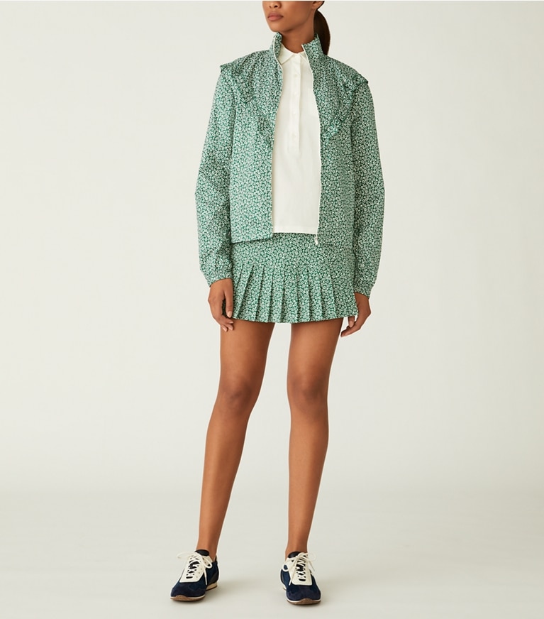 Tory Sport designer bas Jupe de tennis plissée imprimée in Evergreen Ditsy Daisy front