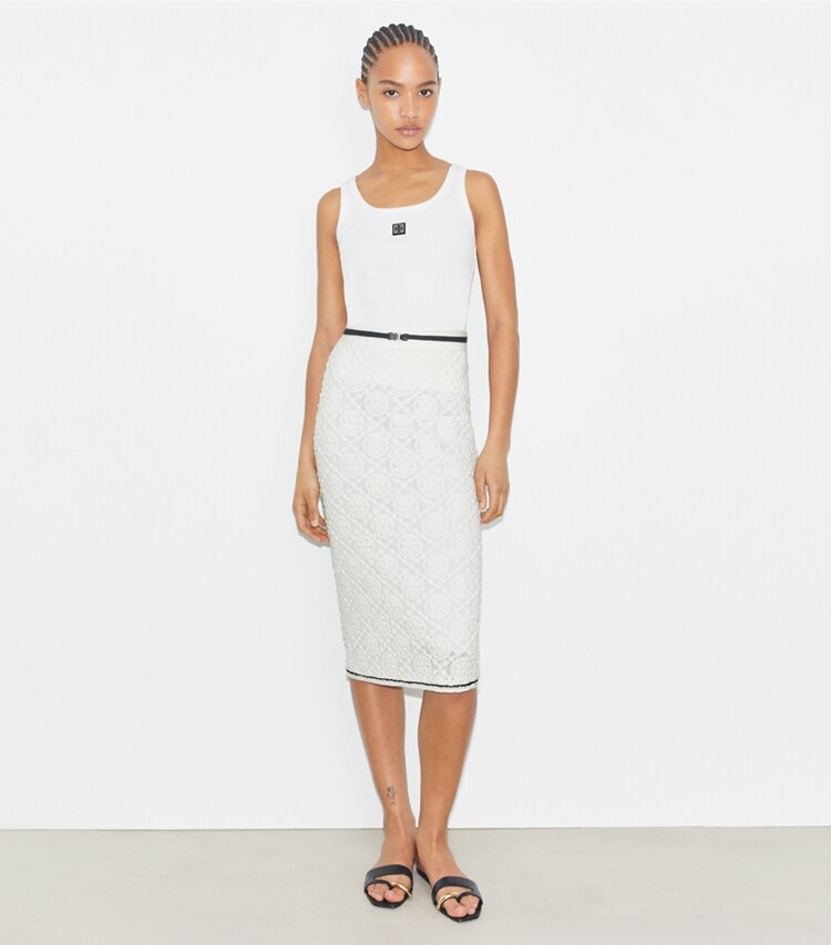 Tory Burch designer bas Jupe en dentelle de coton à logo dans White sur modèle, de face