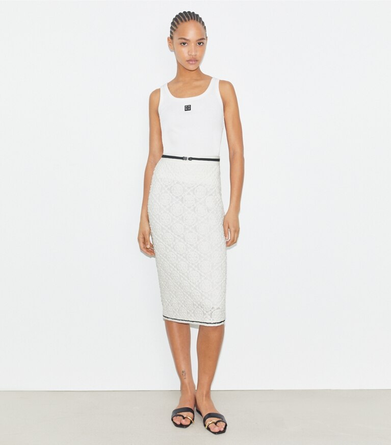 Tory Burch designer bas Jupe en dentelle de coton à logo dans White sur modèle, de face