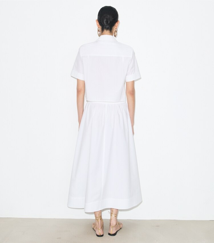 Tory Burch designer bas Jupe en popeline in White on model back