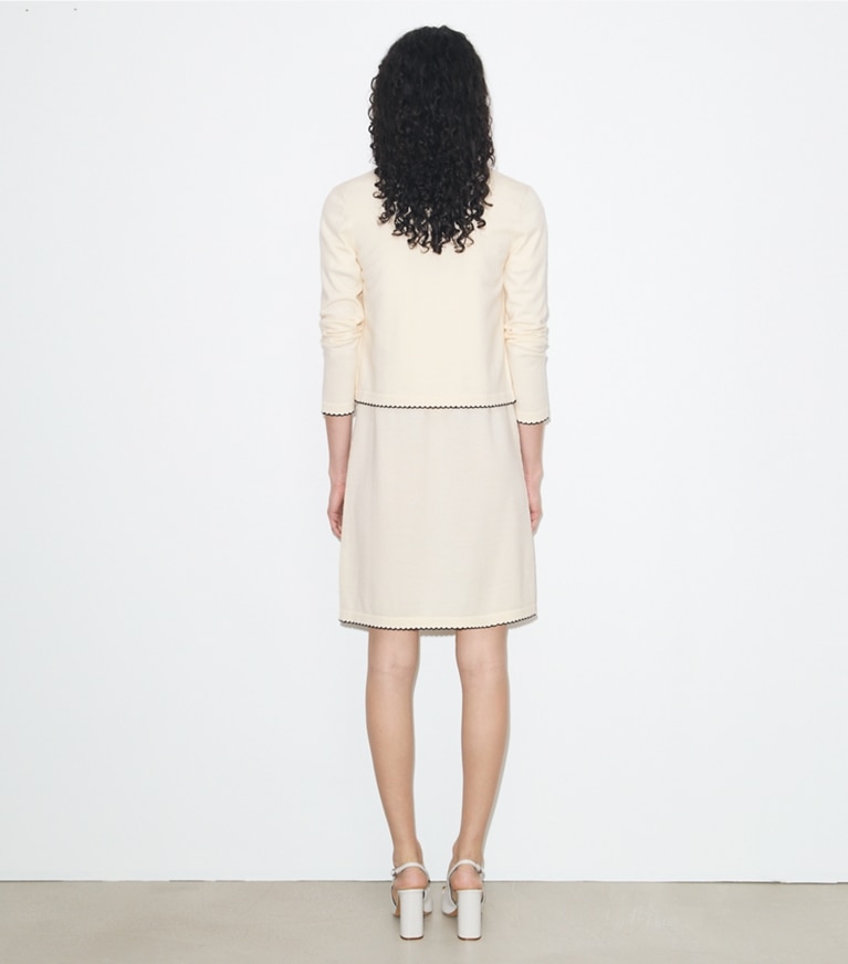 Tory Burch designer sweaters Kendra Wool Scalloped Cardigan in New Ivory / Medium Navy on model back
