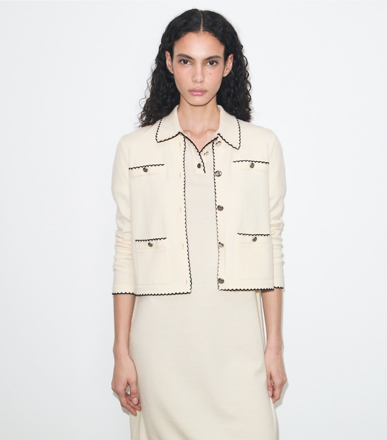 Tory Burch designer sweaters Kendra Wool Scalloped Cardigan in New Ivory / Medium Navy on model detail