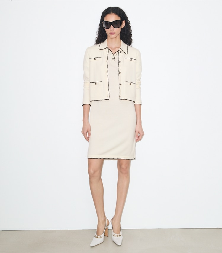 Tory Burch designer sweaters Kendra Wool Scalloped Cardigan in New Ivory / Medium Navy on model front
