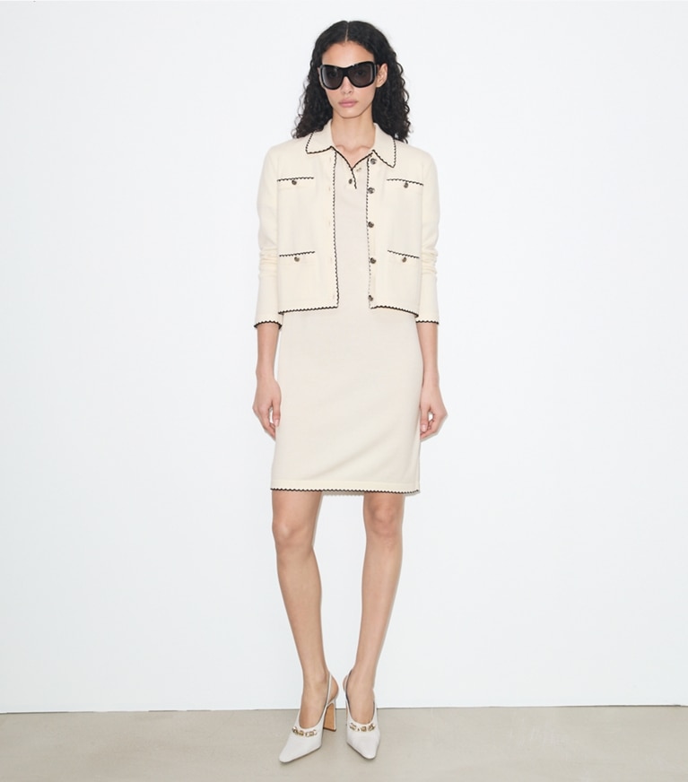 Tory Burch designer sweaters Kendra Wool Scalloped Cardigan in New Ivory / Medium Navy on model front
