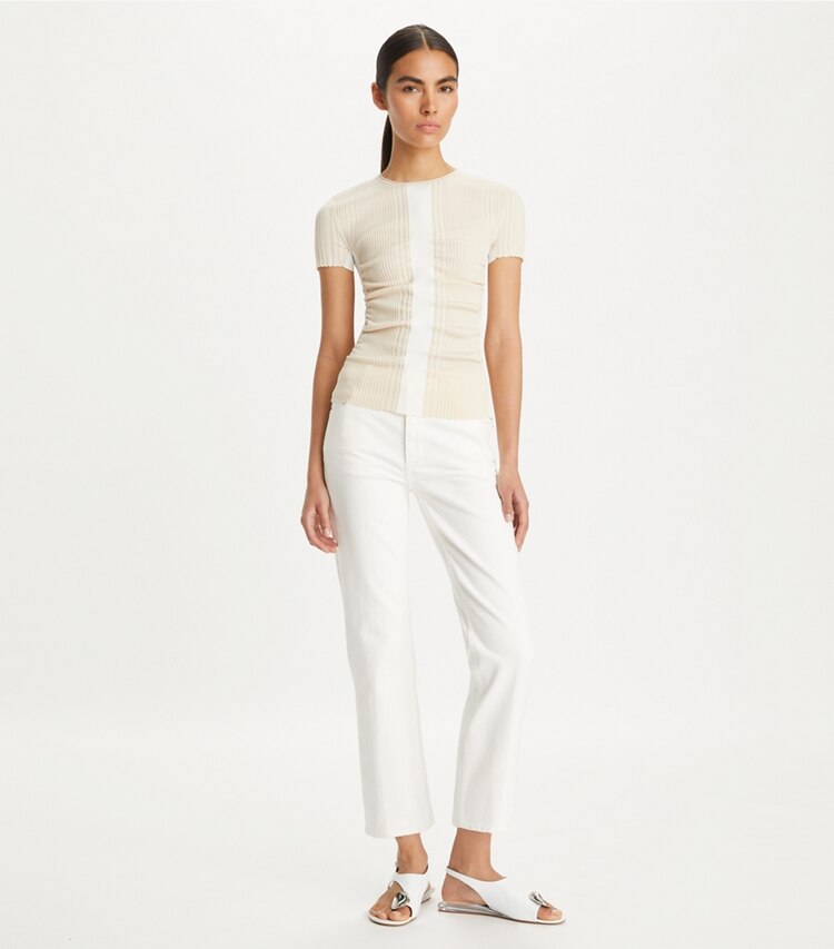 Tory Burch designer bottoms Kick Flare Denim Jean in White Chalk Wash on model front