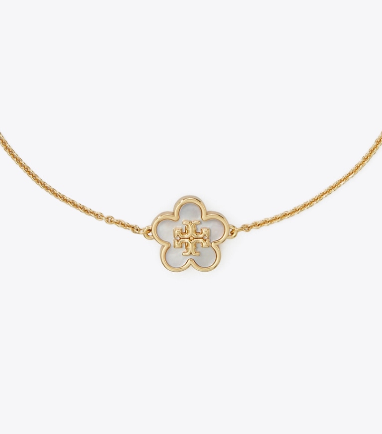 Tory Burch designer armbänder Kira Blumenarmband in Tory Gold / Mother of Pearl front