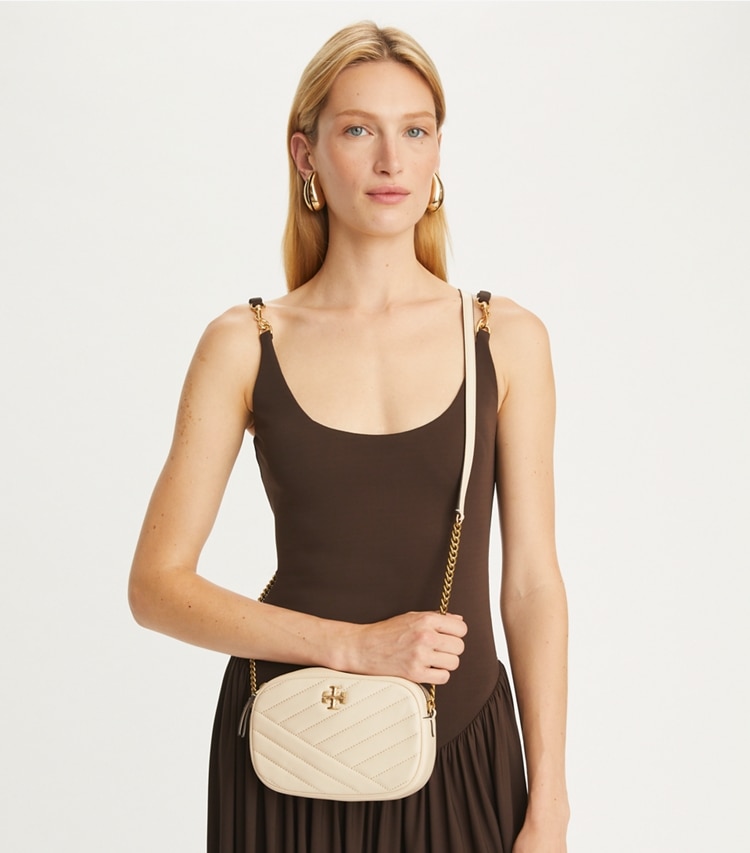 Tory Burch designer crossbody bags Kira Chevron Camera Bag in New Cream accessory on model