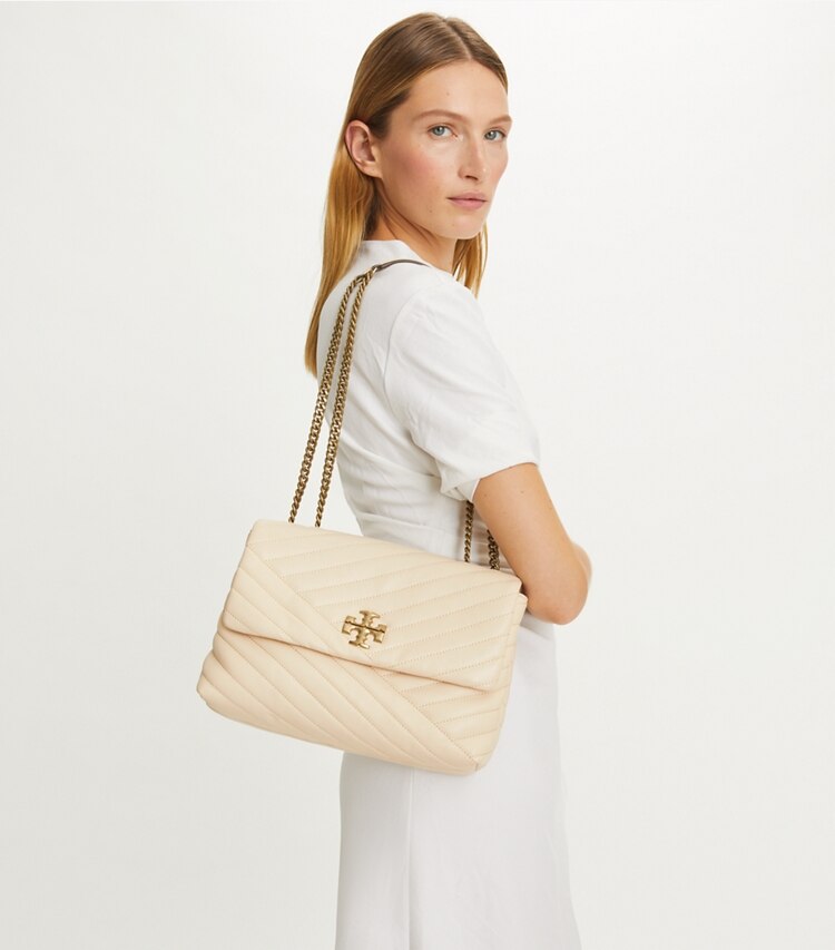Tory Burch designer shoulder bags Kira Chevron Shoulder Bag in New Cream accessory on model