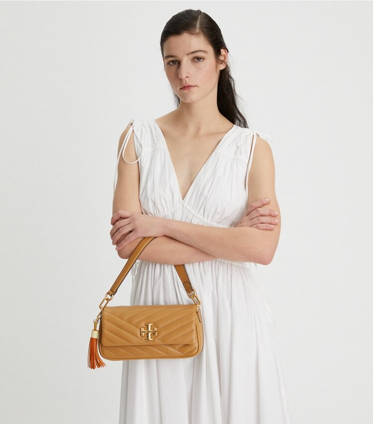 Tory Burch designer shoulder bags Kira Chevron Tassel Small Flap Shoulder Bag in Dusty Almond accessory on model
