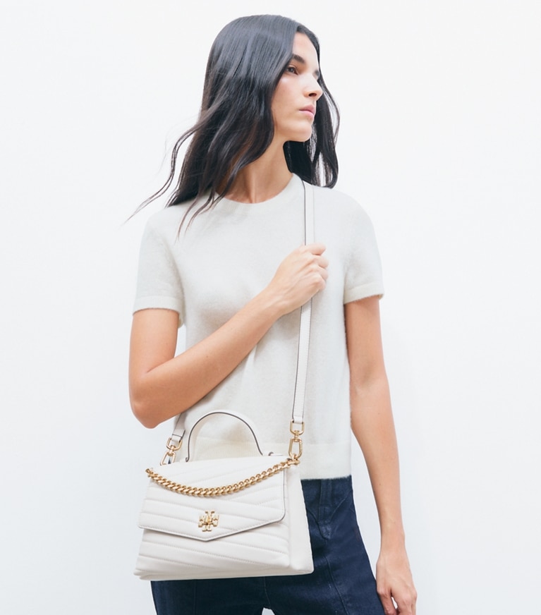 Tory Burch designer satchels Kira Chevron Top-Handle Satchel in New Cream accessory on model