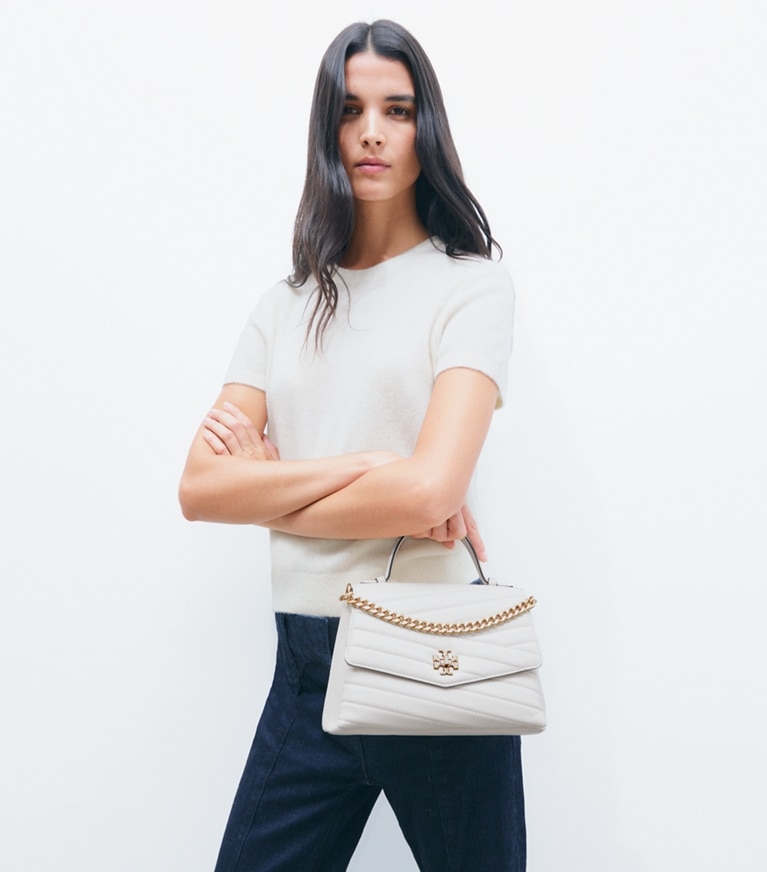 Tory Burch designer satchels Kira Chevron Top-Handle Satchel in New Cream additional on model
