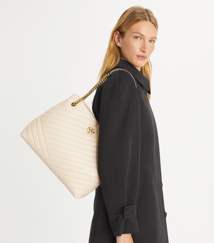 Tory Burch designer tote bags Kira Chevron Tote in New Cream accessory on model