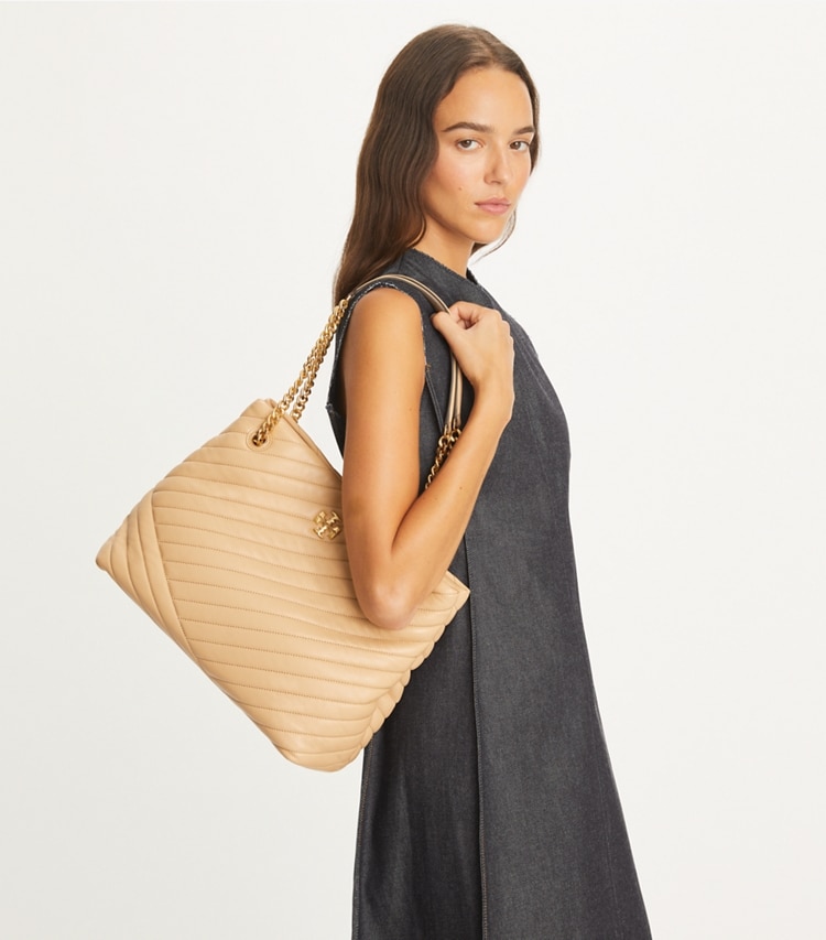 Tory Burch designer tote bags Kira Chevron Tote in Desert Dune accessory on model