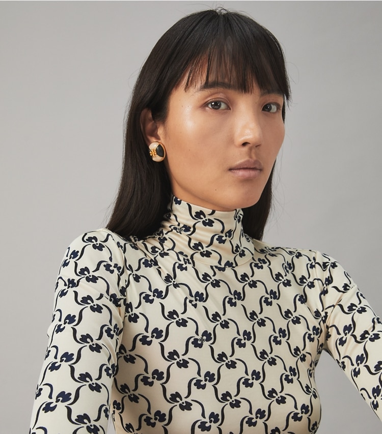 Tory Burch designer earrings Kira Clip-On Earring in Rolled Brass / Ivory / Black accessory on model