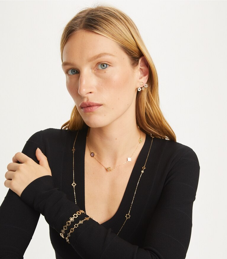Tory Burch designer armbänder Kira Clover Armband mit mehreren Motiven in Tory Gold front