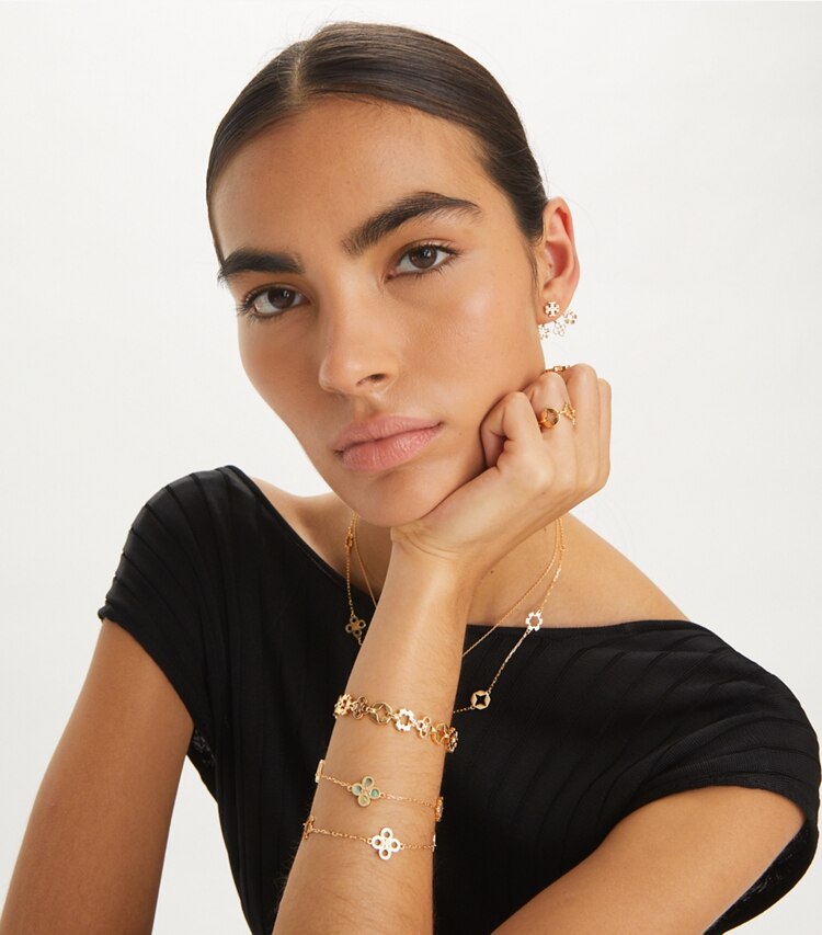 Tory Burch designer bracelets Kira Clover Bracelet in Tory Gold / Green / Pink accessory on model