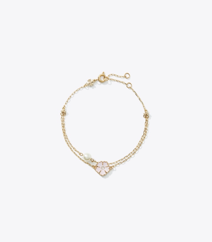 Tory Burch designer ブレスレット キラ クローバー ブレスレット in Tory Gold / Pink / Ivory front