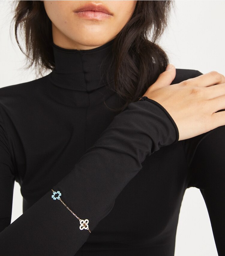 Tory Burch designer bracelets Kira Clover Enamel Bracelet in Tory Gold / Multi accessory on model