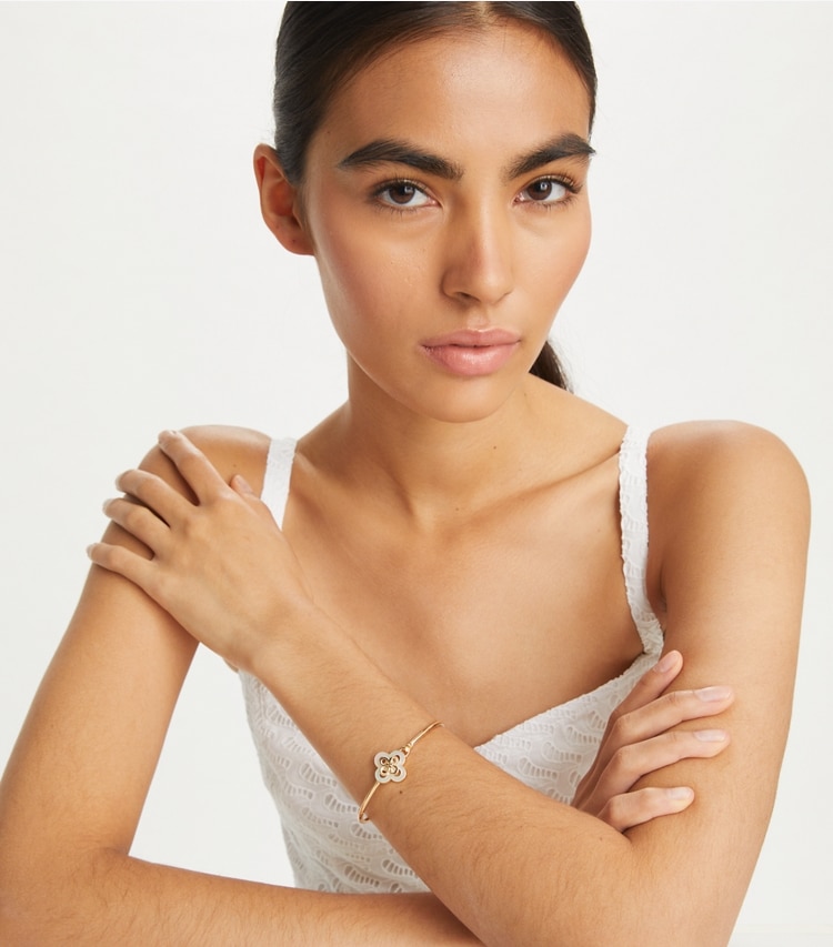 Tory Burch designer bracelets Kira Clover Hinge Bracelet in Tory Gold / Mother of Pearl accessory on model