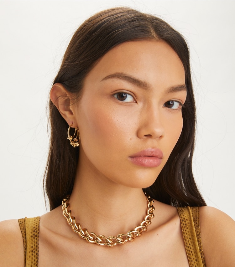 Tory Burch designer earrings Kira Clover Hoop Earring in Tory Gold accessory on model