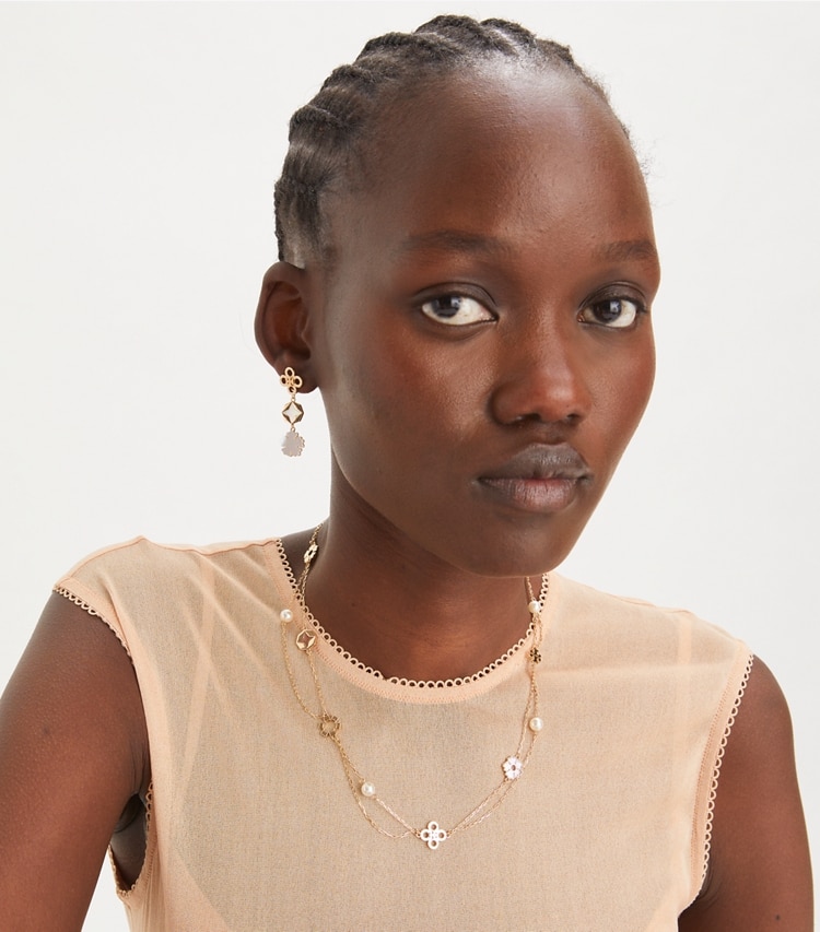 Tory Burch designer earrings Kira Clover Linear Earring in Tory Gold / Mother of Pearl accessory on model