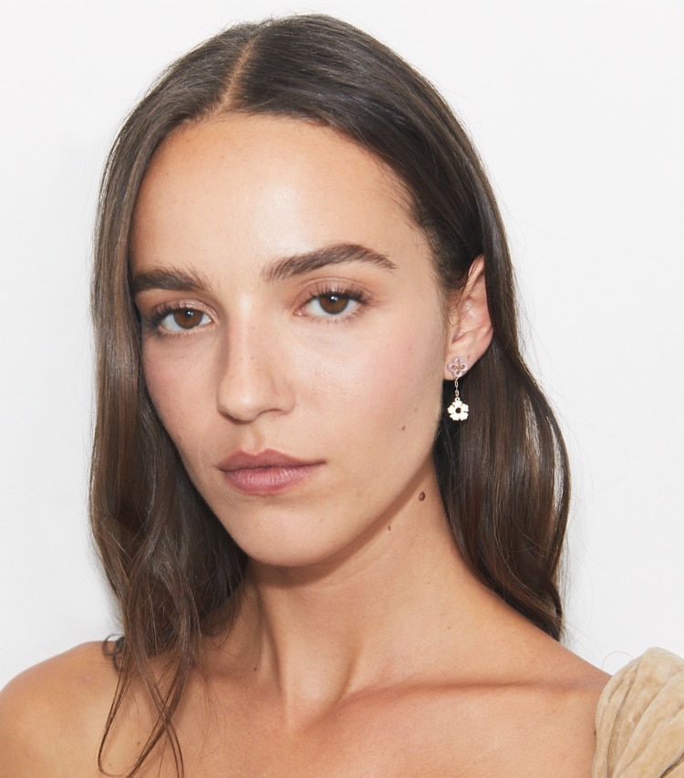 Tory Burch designer earrings Kira Clover Linear Earring in Tory Gold / Pink accessory on model