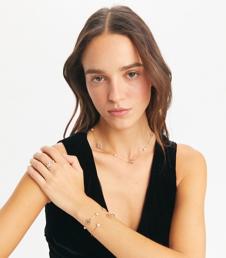 Tory Burch designer bracelets Kira Clover Pearl Cuff in Tory Gold / Pearl / Crystal accessory on model
