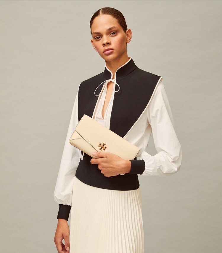 Tory Burch designer clutches Kira Clutch in New Cream accessory on model