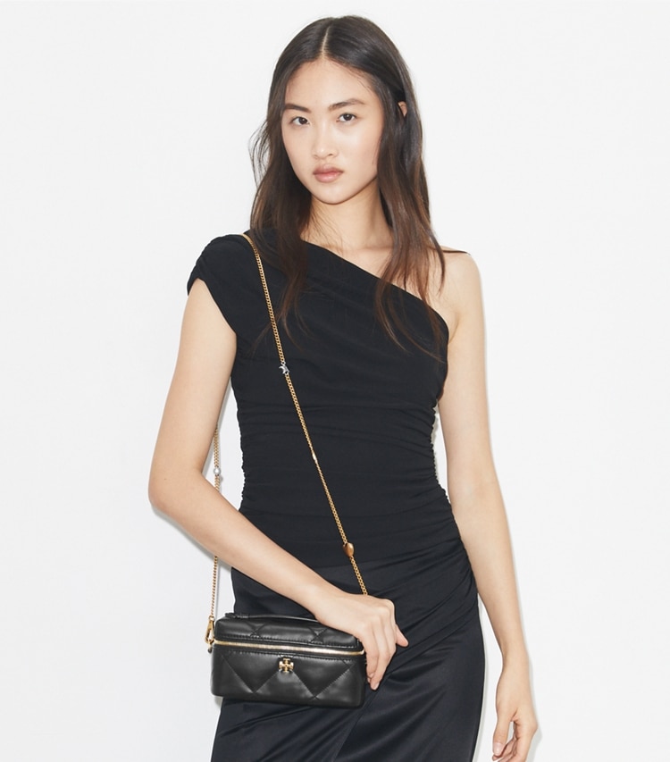 Tory Burch designer mini bags Kira Diamond Quilt Charm East-West Vanity Case in Black accessory on model