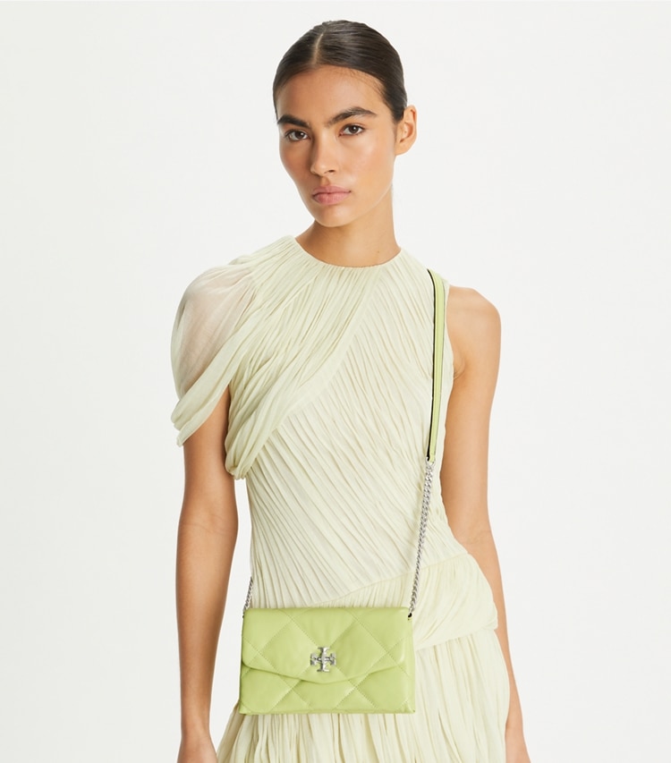Tory Burch designer mini bags Kira Diamond Quilt Crossbody in Fresh Pear accessory on model