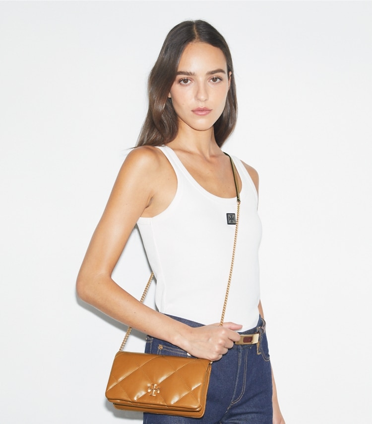 Tory Burch designer mini bags Kira Diamond Quilt Crossbody in Classic Chestnut accessory on model